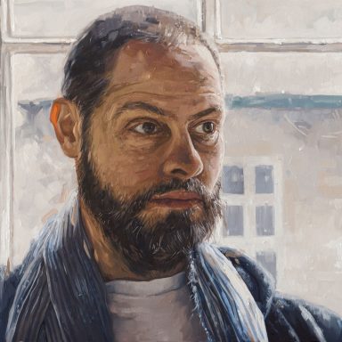 Man in a blue scarf - Richard Portrait of a bearded man with a thoughtful expression, wearing a blue scarf and white shirt.