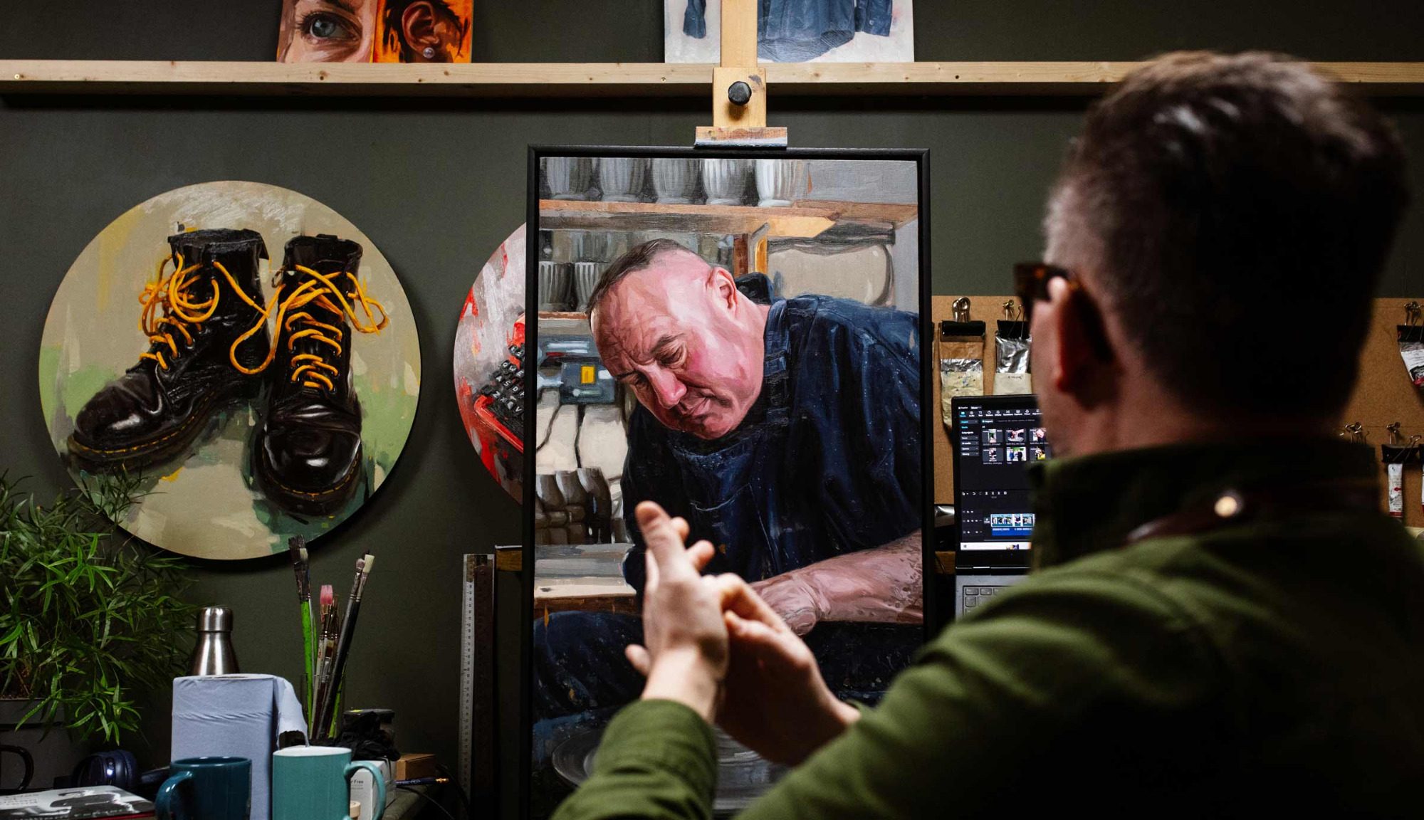 Oliver winconek in his art studio working on a portrait commission.